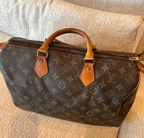 louis vuitton bag on the couch
