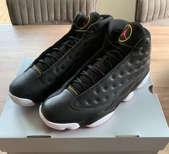 An unboxing moment of a brand new pair of Jordan 13 reps, revealing their premium construction