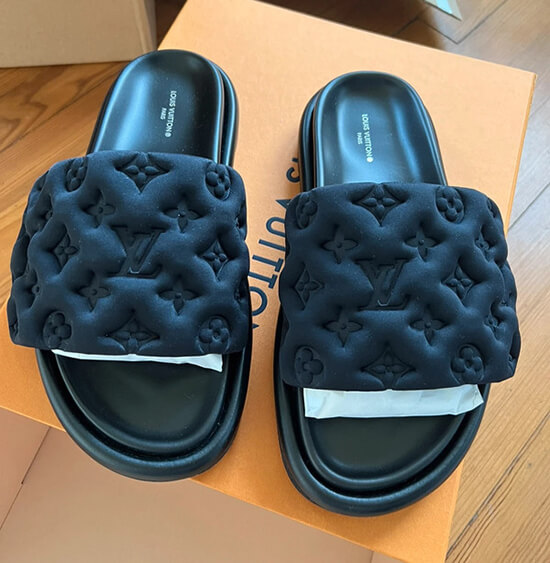 Close-up of a Louis Vuitton slides dupe, highlighting the high-quality materials