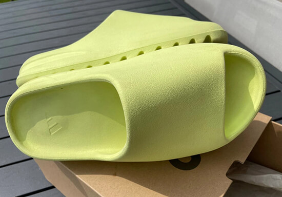 Close-up view of Yeezy slides rep sandals, highlighting the distinctive chunky sole