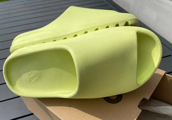 Close-up view of Yeezy slides rep sandals, highlighting the distinctive chunky sole